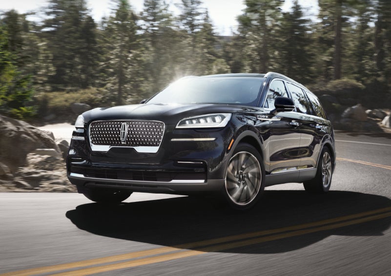 A Lincoln Aviator® SUV is being driven on a winding mountain road | Allan Vigil Lincoln, Inc. in Morrow GA