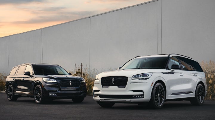Two Lincoln Aviator® SUVs are shown with the available Jet Appearance Package | Allan Vigil Lincoln, Inc. in Morrow GA