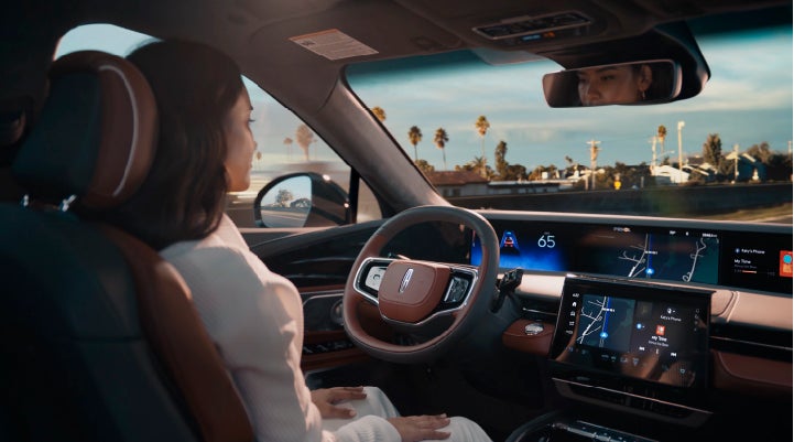 A person is shown driving hands-free on the highway with available Lincoln BlueCruise technology. | Allan Vigil Lincoln, Inc. in Morrow GA